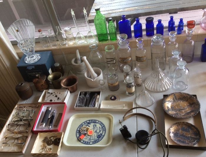 Vintage eyeglasses, lots of pharmacy items including mortar & pestles, apothecary bottles, cobalt blue medicine bottles, big glass funnels 