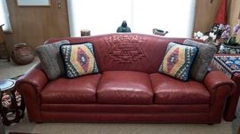 Smith & Gaines Ltd. Red Leather Southwest style sofa 82"L and many assorted pillows perfect for Southwest style retreat, cabin or decor!
