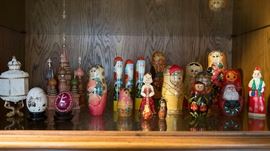 Assorted MATRYOSHKA nesting dolls and miniature St. Basil's catherdral, Ukrainian eggs with decorative stands, Santa figures etc,