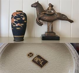 Satsuma Porcelain Vase with Matte Black Glaze and Gold Detail  and "Carousel" cast stone sculpture by Nora Herz