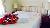 Brass bed, two side tables and pair of matching pottery lamps, crazy quilt with shams
