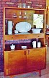 A mid-century Kroehler Danish Modern hutch, Centura by Corning Ware serving pieces.