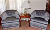 Swivel chairs, crystal lamp and side table