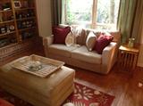 Sofa, hassock, mission style nesting tables, pillows, basket