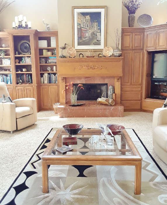 View of living area. Note custom rug,