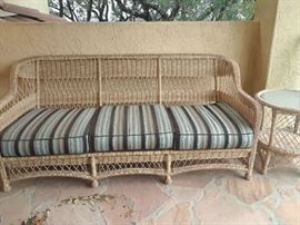 Back cushions on this sofa exist. Just not in the photo. Located on the upstairs gallery.