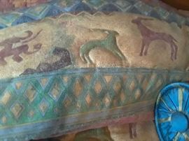 Bed spread is trapunto archaic animal design.