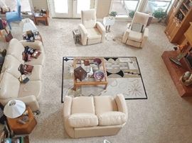 Light tan leather love seat and sofa. Pair of chairs is more of a light chamis color than tan, but it all looks great together. No thinking required. Just move to your place.