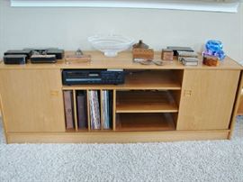 Use alone as a low storage unit, or add book shelves for more storage and display.