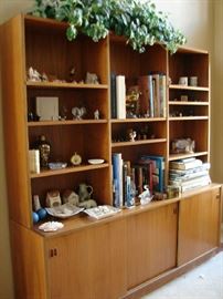 Teak bookcase with sliding doors in base is from Copenhagen. Top sections lift off for moving.