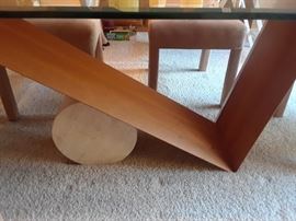 Unique base on the glass top dining table