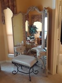 Glamorous vanity with trifold mirror.