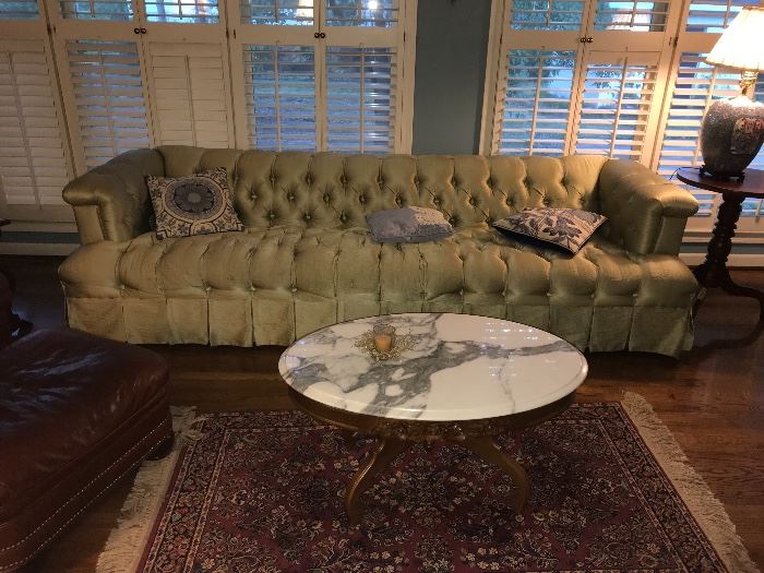 Alternate view of tufted sofa; oval marble top East Lake style coffee table