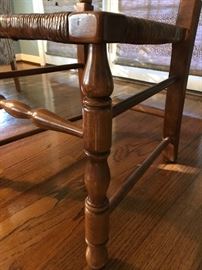 Detailed view of legs on cane seat chairs