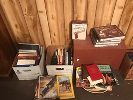 Gun books, stack of old American rifleman, some nat geos.