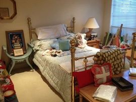 Brass bed, lyre seat and linens.