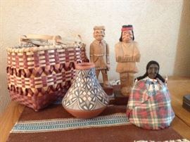 Jemez pottery, basket and carved figures.
