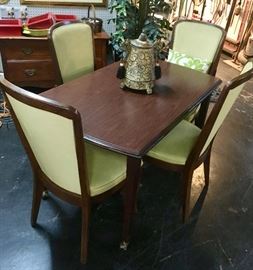 Mid Century Modern Table on casters, with four matching chairs