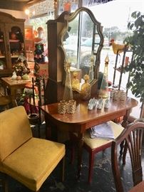 Foyer table, vintage gold mid century modern chair, curved gold framed mirror, decanters, and much more