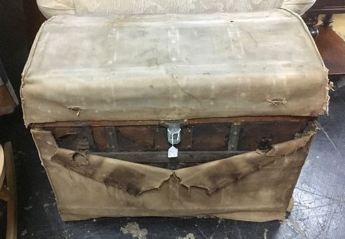 Very old trunk with original canvas cover for travel