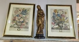 Framed artwork and gold statue