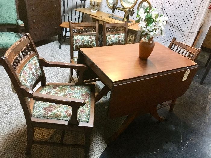 Four upholstered antique chairs, drop leaf mahogany dining table