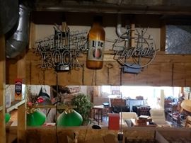 Beer signs: neon, pool table, all different kinds of beer.