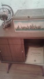 Aeroplane view of Manhattan, record cabinet, musical metal globe