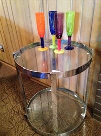 Round 2-tier chrome server on wheels; colorful glasses