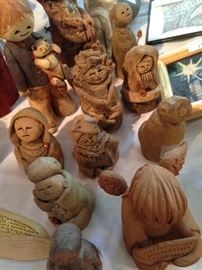 Many clay and carved figures.