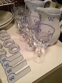 Matching blue & white napkin rings, place holders, beverage glasses, and pitchers