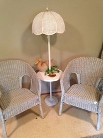 White wicker chairs and table lamp