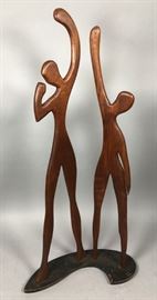 Lot 227 Carved Wood Figural Sculpture. Tall elongated str