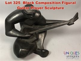 Lot 325 Black Composition Figural Guitar Player Sculpture