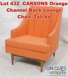Lot 432 CARSONS Orange Channel Back Lounge Chair. Tall ba