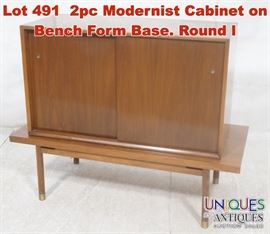 Lot 491 2pc Modernist Cabinet on Bench Form Base. Round l