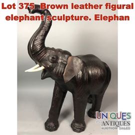 Lot 375 Brown leather figural elephant sculpture. Elephan