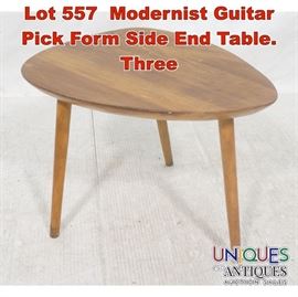 Lot 557 Modernist Guitar Pick Form Side End Table. Three 