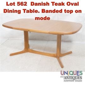 Lot 562 Danish Teak Oval Dining Table. Banded top on mode