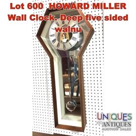 Lot 600 HOWARD MILLER Wall Clock. Deep five sided walnu