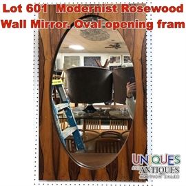 Lot 601 Modernist Rosewood Wall Mirror. Oval opening fram