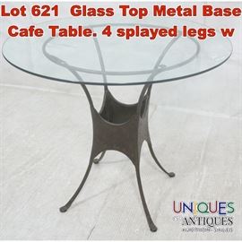 Lot 621 Glass Top Metal Base Cafe Table. 4 splayed legs w