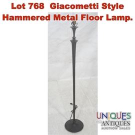Lot 768 Giacometti Style Hammered Metal Floor Lamp. 