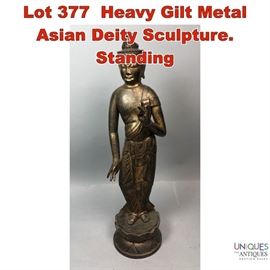 Lot 377 Heavy Gilt Metal Asian Deity Sculpture. Standing