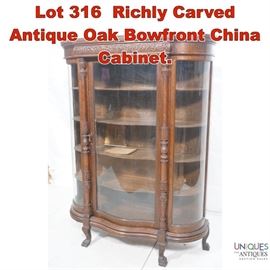 Lot 316 Richly Carved Antique Oak Bowfront China Cabinet.