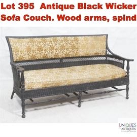 Lot 395 Antique Black Wicker Sofa Couch. Wood arms, spind