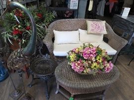 Wicker loveseat and coffee table