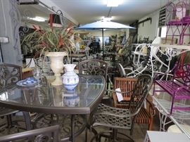 Cast aluminum bar table and swivel stools