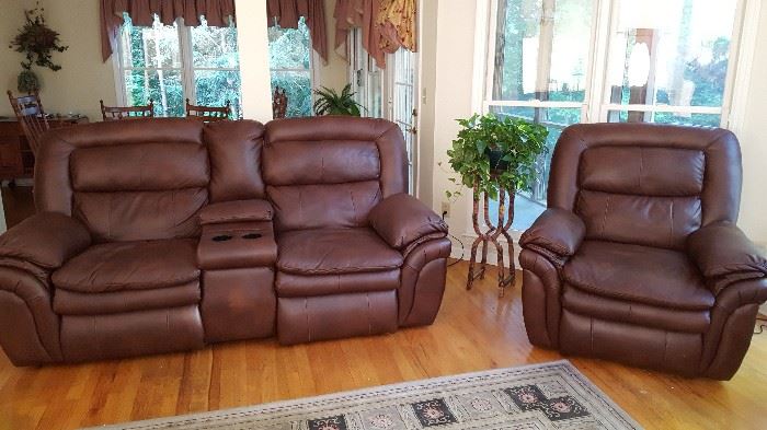 Love seat with cup holder, recliner. This recliner and love seat are electric.