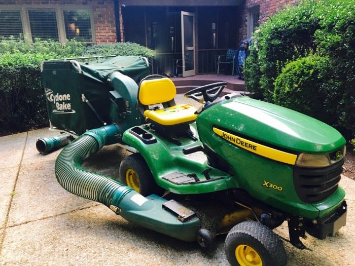John Deere Riding Lawn Mower with Cyclone Rake for leaf and debris removal